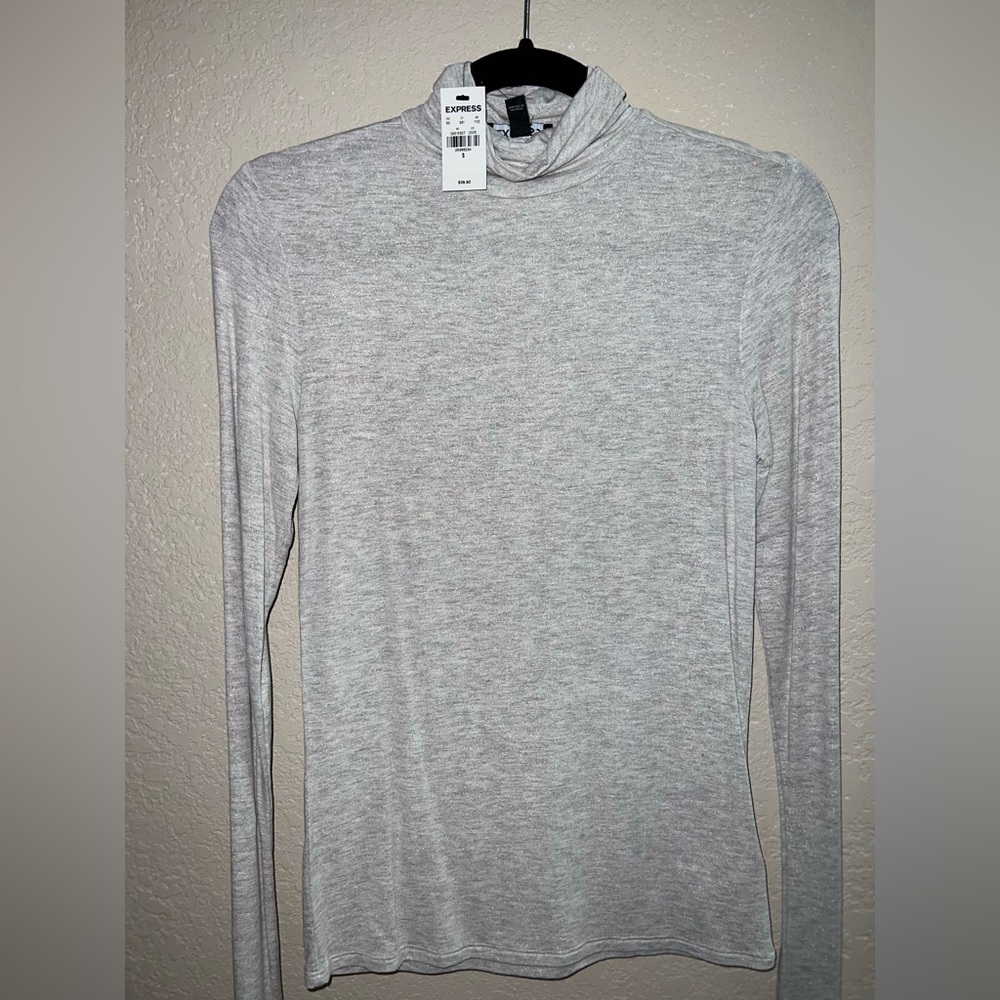 Shimmer turtleneck blouse from Express never worn.
